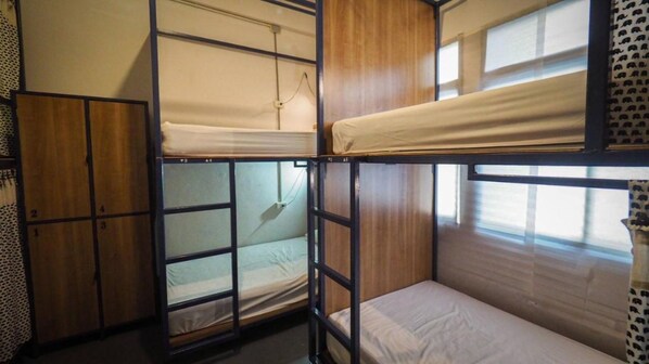 A bunk bed room with a wooden wardrobe and a window. - Arawana Hoft Hostel (Bangkok)