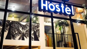 A sign for a hotel named "HOFT Hostel" with a modern design and illuminated letters. - Arawana Hoft Hostel (Bangkok)