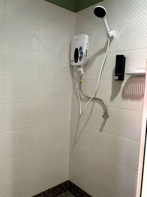 A shower area with a handheld showerhead, a wall-mounted control panel, and a handheld soap dispenser. - 39 Love Lane - Smart Intelligent Inn (George Town)
