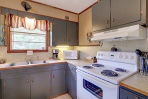 Fridge, microwave, coffee/tea maker, cookware/dishes/utensils