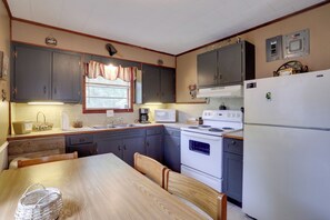 Fridge, microwave, coffee/tea maker, cookware/dishes/utensils