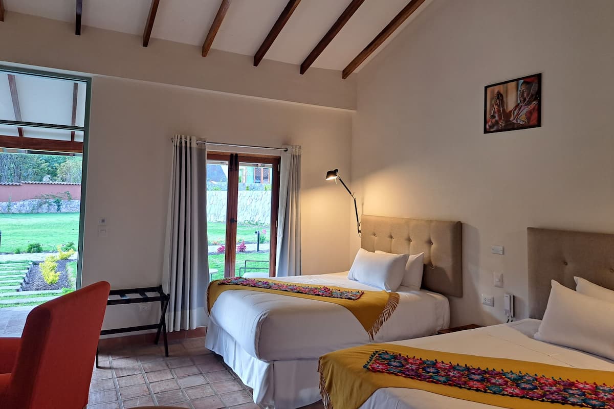 Deluxe Double Room, Garden View | In-room safe, blackout drapes, iron/ironing board, free WiFi