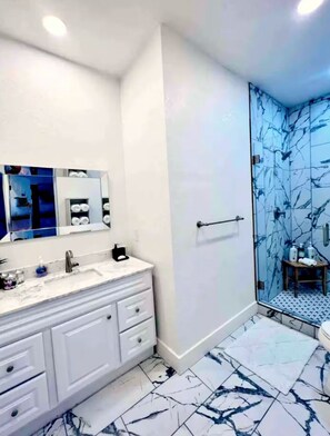 Shower, hair dryer, towels, soap