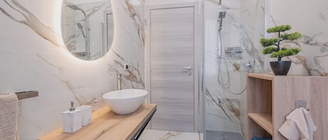 Shower, bidet, towels, soap