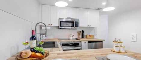 Fridge, microwave, stovetop, coffee/tea maker