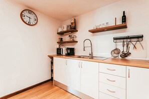 Microwave, coffee/tea maker, cookware/dishes/utensils