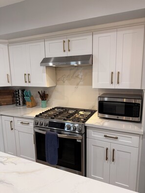 Fridge, microwave, oven, stovetop - Chic Coastal Villa | Pool, Spa & Beach Nearby 6 mi (Long Beach)