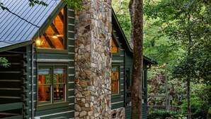 A log cabin with stone walls, large windows, and a metal roof. - *Riverhouse on the Cartecay*WaterFront~Tube~Family (Ellijay)