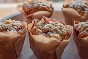 A tray of baked goods in paper cups. - Historic Inn with River Views - King Room Four (Chattanooga)