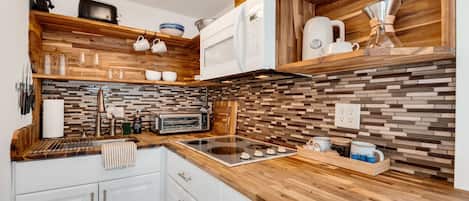 Fridge, microwave, stovetop, coffee/tea maker