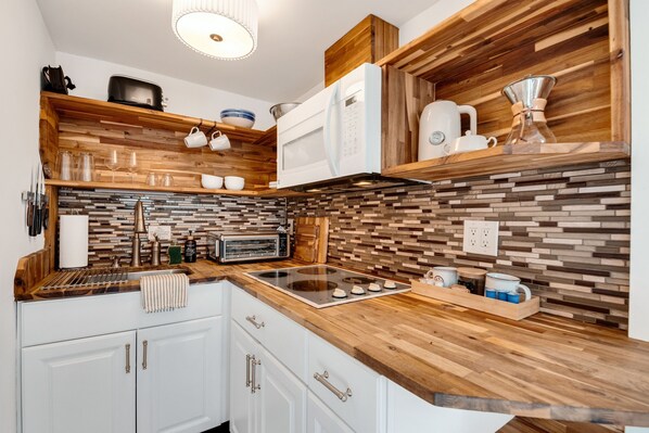 Fridge, microwave, stovetop, coffee/tea maker