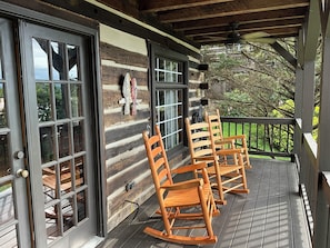 Relax on the deck with comfortable rocking chairs and take in the serene surroundings.