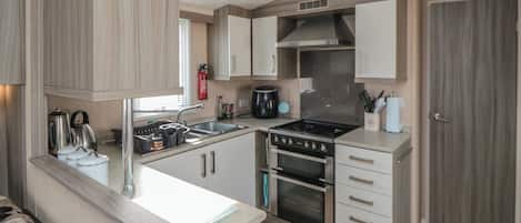 Fridge, microwave, cookware/dishes/utensils