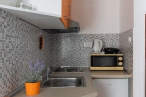 Fridge, microwave, stovetop, dining tables