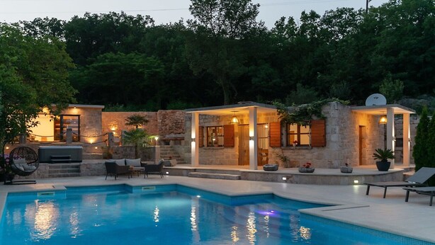 A pool area with stone walls, outdoor seating, and a satellite dish. - Villa Mia 2 - Six Bedroom Villa with Private Pool (Krivodol)