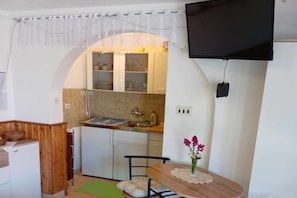 Fridge, stovetop, coffee/tea maker, dining tables