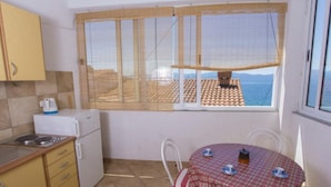 Fridge, stovetop, dining table