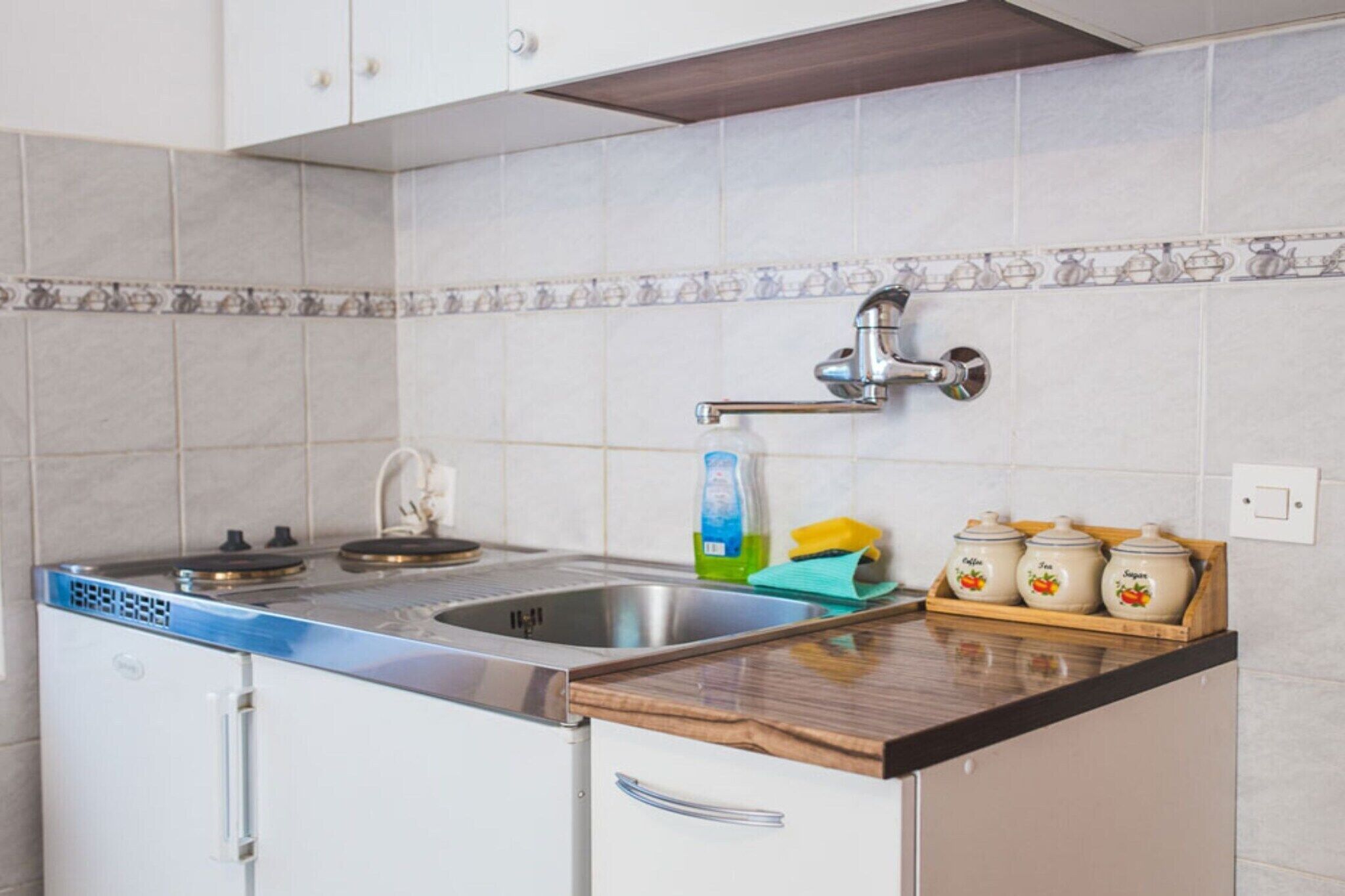 Fridge, stovetop, coffee/tea maker, dining tables