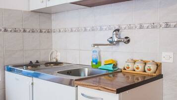 Fridge, stovetop, coffee/tea maker, dining tables