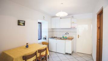 Fridge, stovetop, coffee/tea maker, dining tables