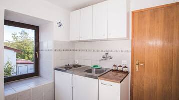 Fridge, stovetop, coffee/tea maker, dining tables