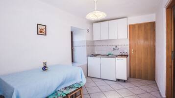 Fridge, stovetop, coffee/tea maker, dining tables