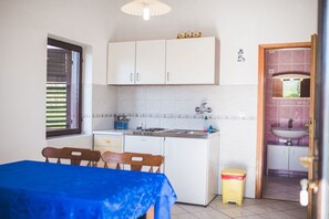 Fridge, stovetop, coffee/tea maker, dining tables