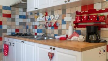 Fridge, stovetop, coffee/tea maker, dining tables