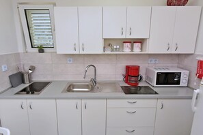 Fridge, microwave, coffee/tea maker, dining tables