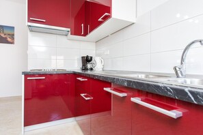 Fridge, stovetop, dining tables - Comfort apartment with balcony and pool (Krk)