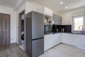 Fridge, microwave, oven, stovetop - Trendy and Chic Apartment with Terrace and Private Garden - One Bedroom Apartment (Kastel Stari)