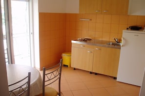 Fridge, oven, stovetop, dining tables