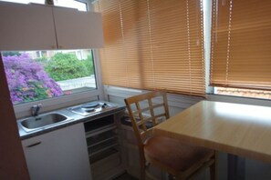 Fridge, microwave, stovetop, dining tables