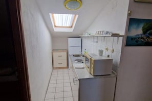 Fridge, stovetop, dining tables
