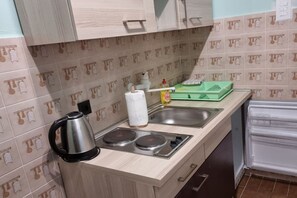 Fridge, stovetop, dining tables