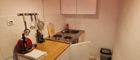 Fridge, stovetop, dining tables