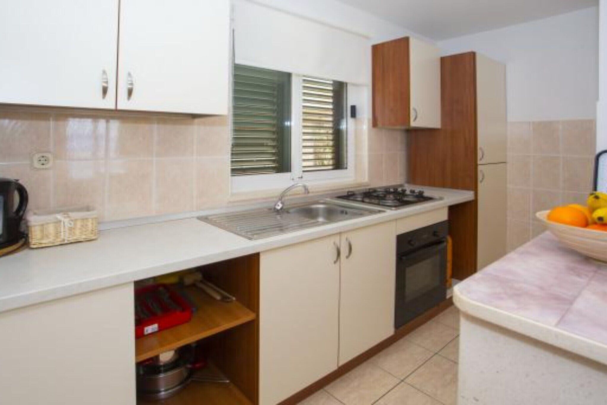 Fridge, oven, stovetop, dining tables