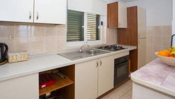 Fridge, oven, stovetop, dining tables