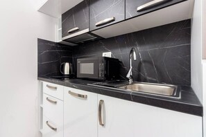 Fridge, microwave, oven, stovetop - Modern Apartments with Private Balcony - Deluxe One Bedroom Apartment (Kastel Novi)