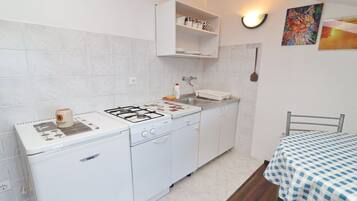 Fridge, oven, stovetop, dining table