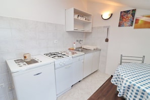 Fridge, oven, stovetop, dining tables