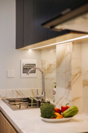 Coffee/tea maker, electric kettle, dining tables - Madison Urban Stay (Hanoi)