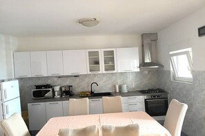 Fridge, microwave, oven, stovetop - Seaside Okrug Gornji Apartment with Terrace and Patio - Two Bedroom Apartment with Terrace (Okrug Gornji)