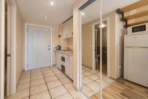 Fridge, microwave, stovetop, dining tables