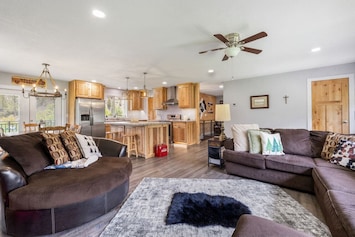 Spacious living room with cozy sofas and an open layout—perfect for relaxing and gathering with loved ones.