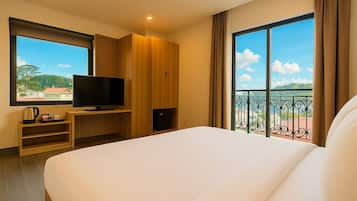 Deluxe Double with Balcony | Premium bedding, desk, soundproofing, free WiFi