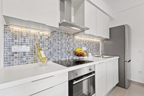 Apartment, 1 Bedroom | Private kitchen | Full-size fridge, oven, stovetop, espresso maker