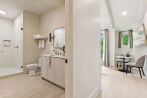 A modern bathroom with a shower, toilet, and sink. - Casa Riviera, a ZenStay Hotel - Studio 28 (Santa Barbara)