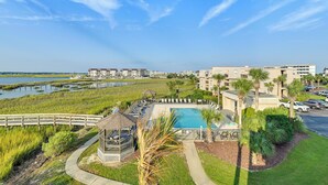 A resort with a pool, a gazebo, and a boardwalk overlooking a body of water. - Walk to Beach & Marsh: Condo in Murrells Inlet (Murrells Inlet)