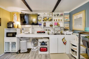 A compact kitchen with a microwave, toaster, and sink. - 1 Mi to Dtwn: Fayetteville Studio w/ Patio (Fayetteville)
